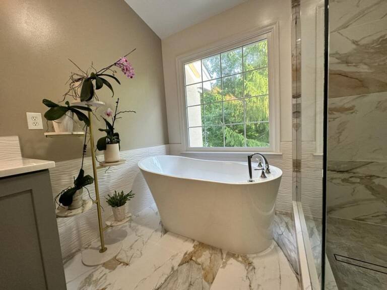 Remodeled bathroom with a freestanding tub